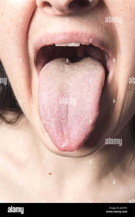 Closeup woman tongue Stock Photo - Alamy