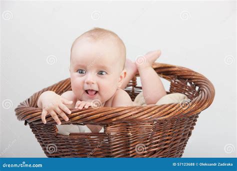 Newborn baby in basket stock photo. Image of laughing - 57123688