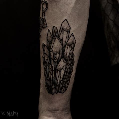 Black crystal cluster forearm tattoo - Tattoogrid.net