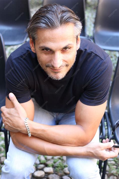 man sitting in chair 1