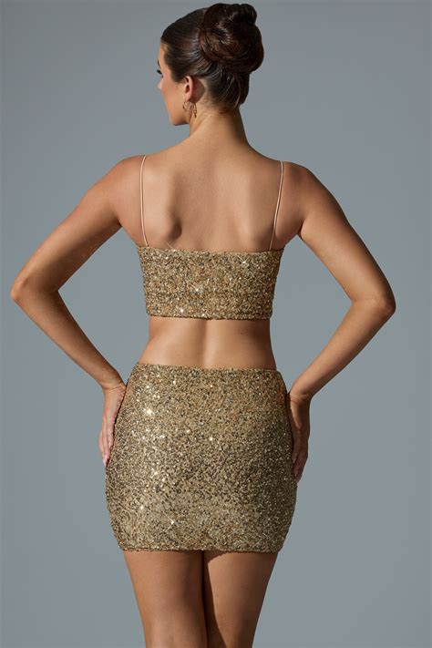 Aubrey Embellished Mid-Rise Mini Skirt in Gold | Oh Polly