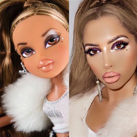 two dolls with different hair styles and make - up
