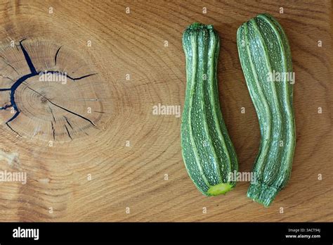 zucchini costata romanesco   wooden board stock photo alamy
