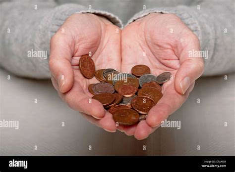 Close up of man person hands holding English money change cash coin ...