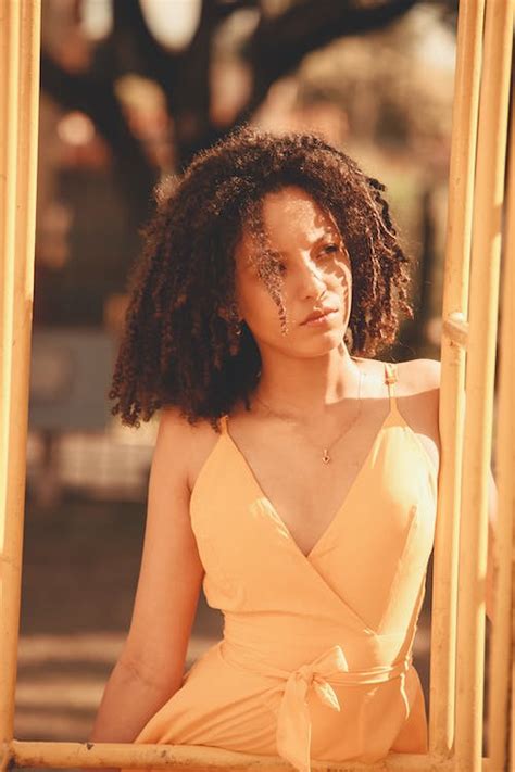 A Woman with Curly Hair · Free Stock Photo