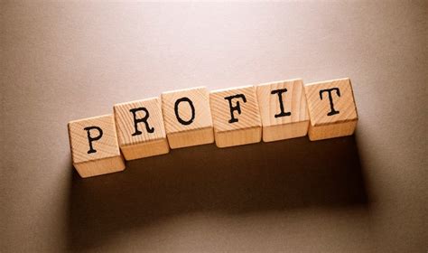 premium photo profit word written  wooden cubes