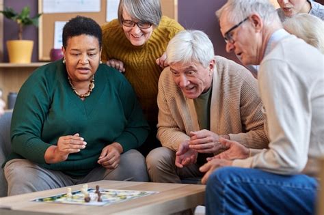 premium photo senior people playing board games