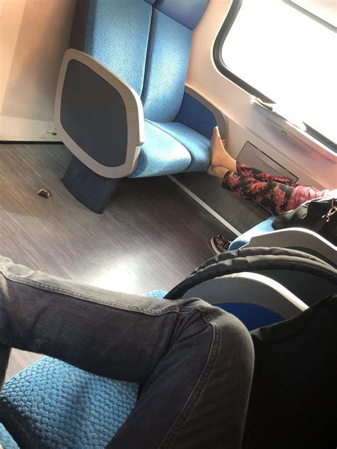 Resting your bare feet on a train seat. : r/trashy