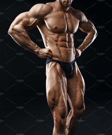 Bodybuilder man with perfect abs containing muscle, bodybuilder, and