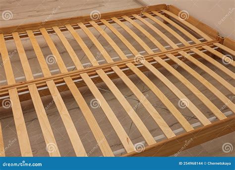 wooden bed frame  floor  room closeup view stock photo image