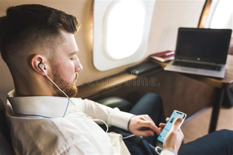 Young Attractive and Successful Businessman is Resting and Listening To ...