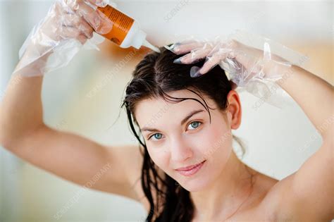 woman applying hair colour shampoo stock image  science