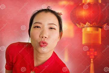 Young Beautiful and Happy Asian Chinese Woman in Traditional Bun Hair