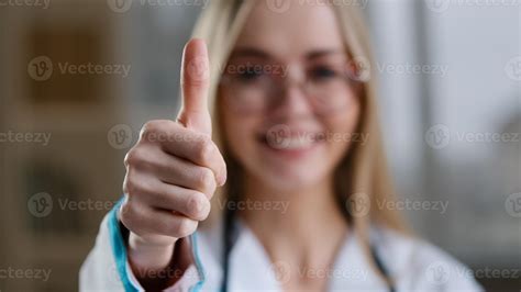 Caucasian smiling happy millennial woman doctor in glasses nurse