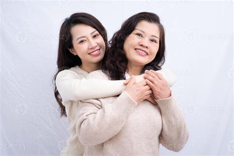 Portrait of Asian mother and daughter on white background 6855417 Stock