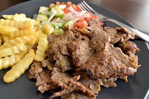turkish meat doner kebab  chips  vegetable salad   plate