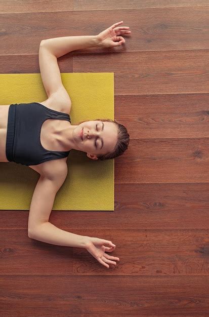 Premium Photo | Calm female practicing yoga and showing om gesture