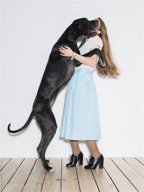 "Woman And Her Big Dog" by Stocksy Contributor "Danil Nevsky" - Stocksy