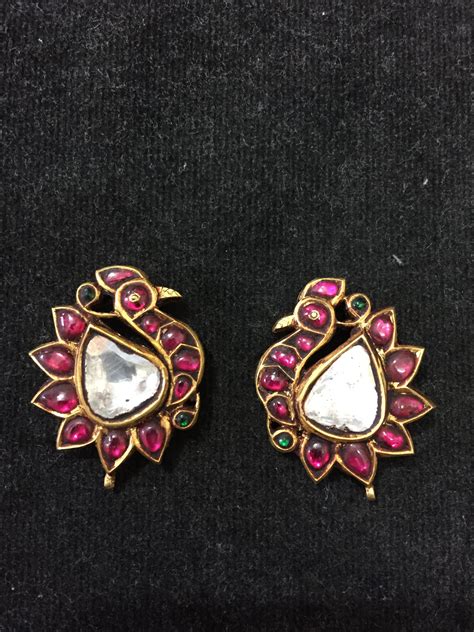 Bird design earings, rubies with uncut diamonds in gold. South Indian