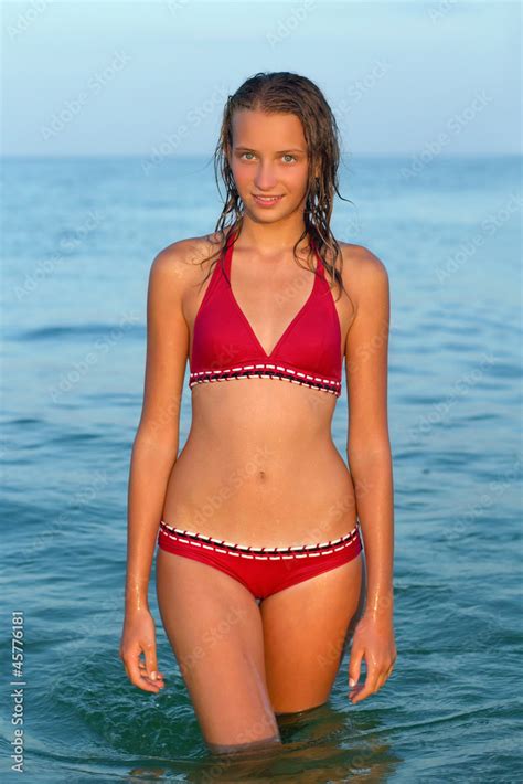smiling teen girl in the sea Stock Photo | Adobe Stock