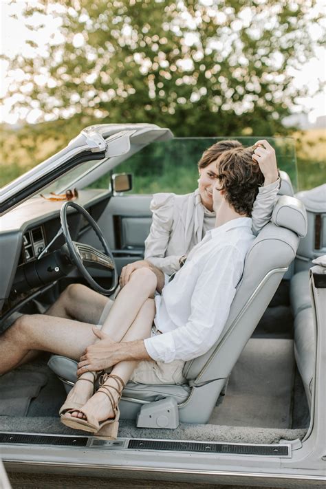 A Woman Sitting on the Man's Lap While in the Car · Free Stock Photo