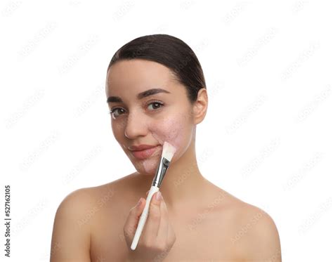 Woman applying pomegranate face mask on white background Stock-Foto ...
