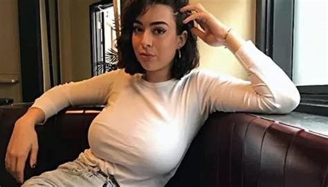 Busty brunette on the couch - 9GAG