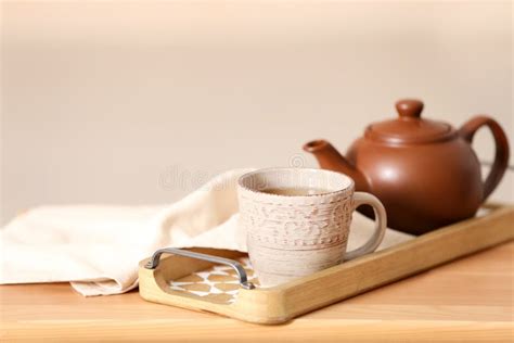 Tray with tea set on table stock photo. Image of light - 126244498