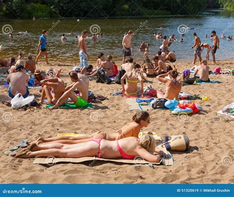 People Sunbathing and Swimming in Moskva River Beach at Serebryany Bor