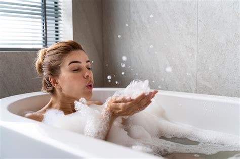 Free Photo | Woman enjoying a relaxing bubble bath