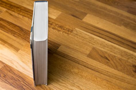Free Photo | Vertical book on wooden surface