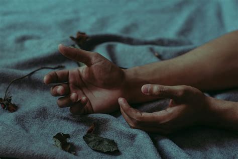 person lying  gray textile  stock photo