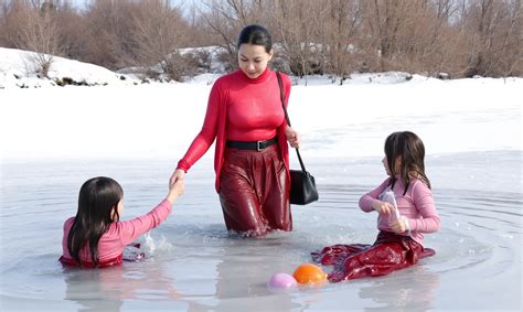There are three girls in the water playing with a ball - SeaArt AI