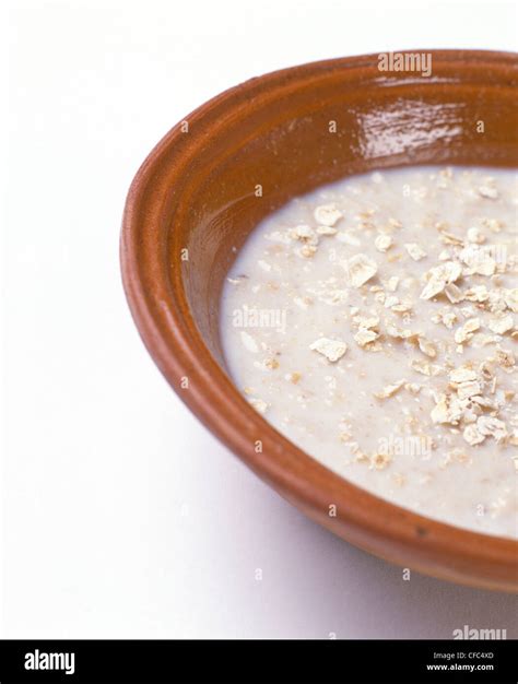 porridge oats  milk  terracotta bowl stock photo alamy