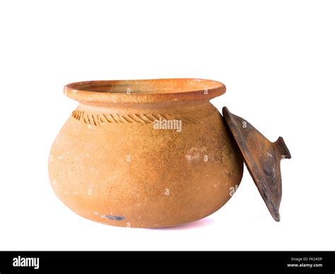 Pots made of traditional clay for use in the kitchen. On a white ...