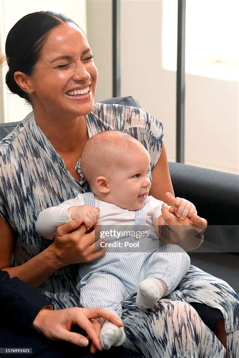 Meghan, Duchess of Sussex laughs as she holds her baby son Archie ...