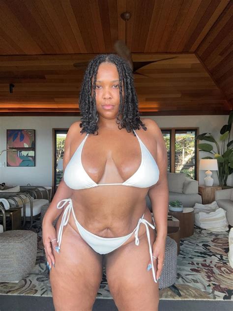 Lizzo looks slimmer than ever as she poses in white bikini