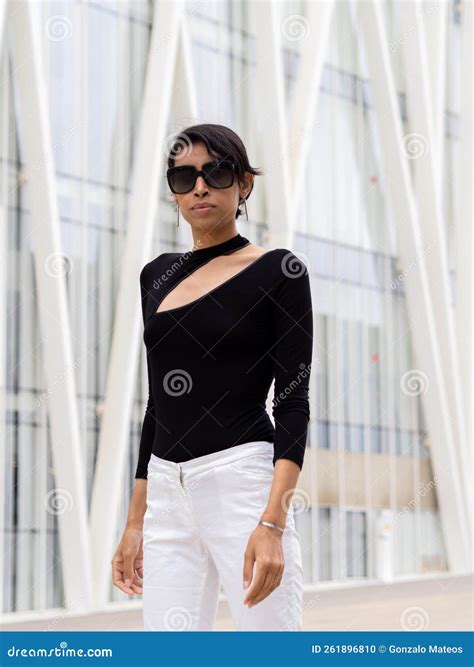 Fashion Transsexual Woman Posing in a City Looking at Camera with
