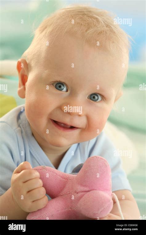 Happy blond baby Stock Photo - Alamy