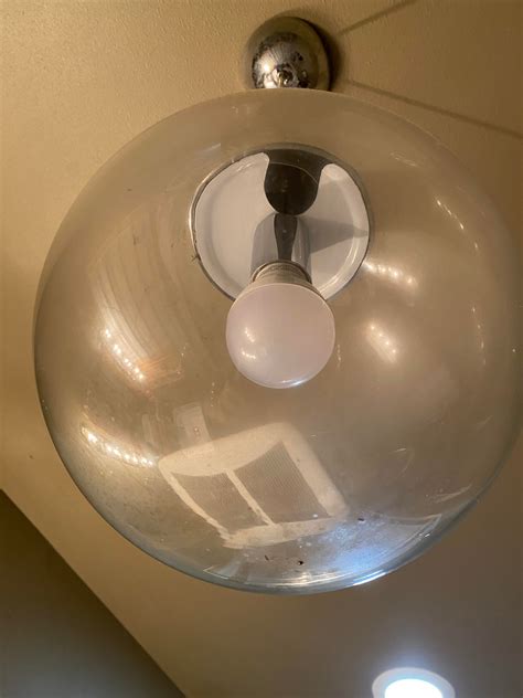 Help: How to remove this globe to change the bulb? : r/Lighting