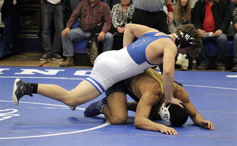 Determined to dominate: QHS wrestlers lose only one match in sweeping