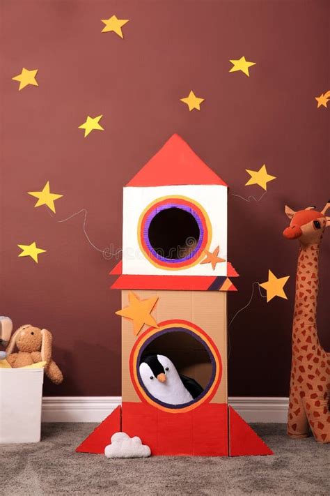 Child`s Room Interior with Cardboard Rocket and Toys Stock Photo ...