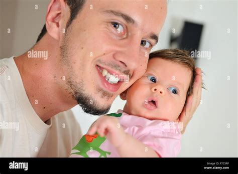 indoor portrait with happy young famil and cute little babby Stock ...
