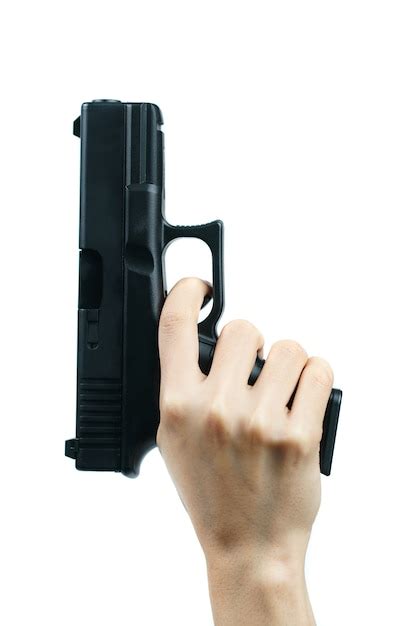 Premium Photo | Hand holding gun