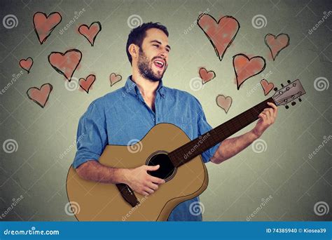 handsome musician young man  love playing guitar  singing  song