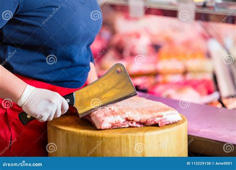 butcher woman chopping meat   block stock photo image  butcher