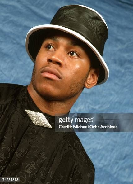 Rapper LL Cool J poses for a portrait session wearing a suit and hat ...