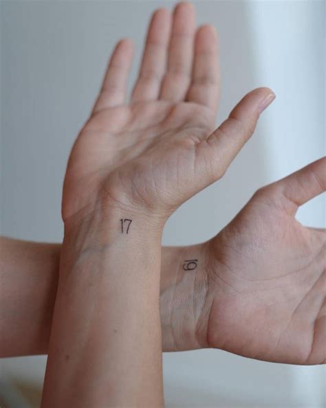 Individual matching numbers "19" and "17" tattooed on