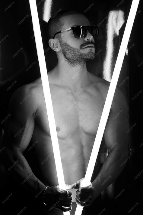 Free Photo | Naked male model in shadow with light sorrow looking upside