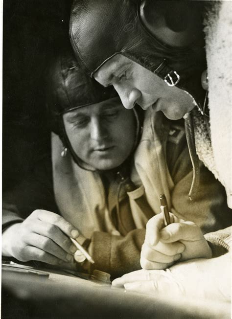 Two Luftwaffe pilots in flight gear studying map, January 1942 | The